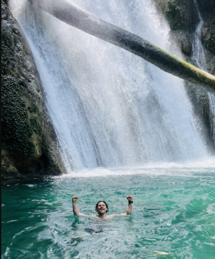 Clear waterfall surrounded by jungle in Du Gia Ha Giang