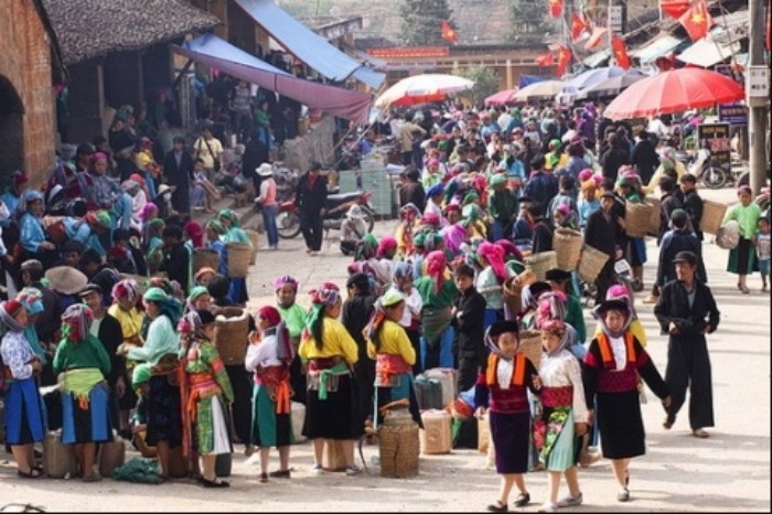 Ethnic H’mong women in traditional dress at a market in Ha Giang